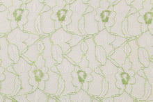 Load image into Gallery viewer, This lace features a woven floral design in white with green outline.
