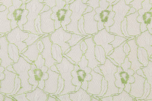 This lace features a woven floral design in white with green outline.