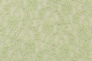  This lace features a woven floral design in light green .