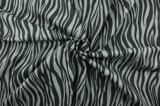 This fabric features striated stripes in gray and black.  The multi use fabric is perfect for window treatments, decorative pillows, custom cushions, bedding, light duty upholstery applications and almost any craft project.  It has a soft workable feel yet is stable and durable.  