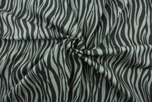 Load image into Gallery viewer, This fabric features striated stripes in gray and black.  The multi use fabric is perfect for window treatments, decorative pillows, custom cushions, bedding, light duty upholstery applications and almost any craft project.  It has a soft workable feel yet is stable and durable.  
