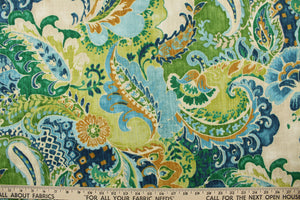 This fabric features a paisley design in golden tan, green, blue and off white. 