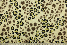 Load image into Gallery viewer, This fabric features a giraffe print design in shades of brown, black and khaki on a tan background.  The multi use fabric is perfect for window treatments, decorative pillows, custom cushions, bedding, light duty upholstery applications and almost any craft project.  It has a soft workable feel yet is stable and durable.  
