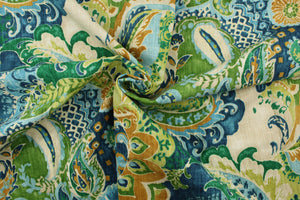 This fabric features a paisley design in golden tan, green, blue and off white. 