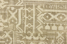 Load image into Gallery viewer, This fabric features a patchwork ethnic design in brown and off white.  The cotton and linen fabric was woven with basket weaves for more texture.  It is perfect for window treatments, decorative pillows, handbags, light duty upholstery applications.  This fabric has a soft workable feel yet is stable and durable with 27,000 double rubs.  

