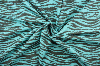 This fabric features striated stripes in aqua and gray.  The multi use fabric is perfect for window treatments, decorative pillows, custom cushions, bedding, light duty upholstery applications and almost any craft project.  It has a soft workable feel yet is stable and durable