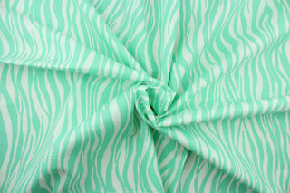 This fabric features striated stripes in mint green and white.  The multi use fabric is perfect for window treatments, decorative pillows, custom cushions, bedding, light duty upholstery applications and almost any craft project.  It has a soft workable feel yet is stable and durable.  