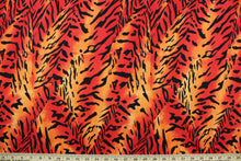 Load image into Gallery viewer, Verdant is an animal print design in vibrant orange, red and black.  The multi use fabric is perfect for window treatments, decorative pillows, custom cushions, bedding, light duty upholstery applications and almost any craft project.  It has a soft workable feel yet is stable and durable.  
