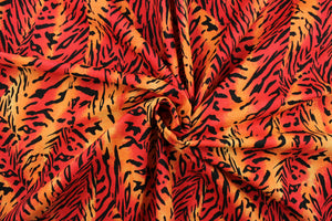 Verdant is an animal print design in vibrant orange, red and black.  The multi use fabric is perfect for window treatments, decorative pillows, custom cushions, bedding, light duty upholstery applications and almost any craft project.  It has a soft workable feel yet is stable and durable.  