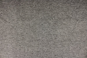 This high end upholstery weight fabric is suited for uses that requires a more durable fabric.  Colors included are varying shades of gray.  The reinforced backing makes it great for upholstery projects including sofas, chairs, dining chairs, pillows, handbags and craft projects.  It is soft and pliable and would make a great accent to any room.