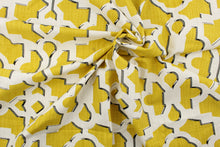 Load image into Gallery viewer, This fabric features a geometric design in mustard yellow outlined in gray and black against a white background.
