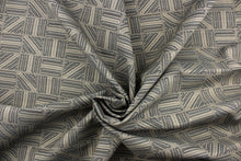 Load image into Gallery viewer, This high end upholstery weight fabric features a geometric design in blue and beige on a metal gray background.  It is suited for uses that requires a more durable fabric.  The reinforced backing makes it great for upholstery projects including sofas, chairs, dining chairs, pillows, handbags and craft projects.  It is soft and pliable and would make a great accent to any room. 

