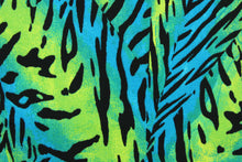 Load image into Gallery viewer, Verdant is an animal print design in vibrant teal, lime green and black.  The multi use fabric is perfect for window treatments, decorative pillows, custom cushions, bedding, light duty upholstery applications and almost any craft project.  It has a soft workable feel yet is stable and durable.  
