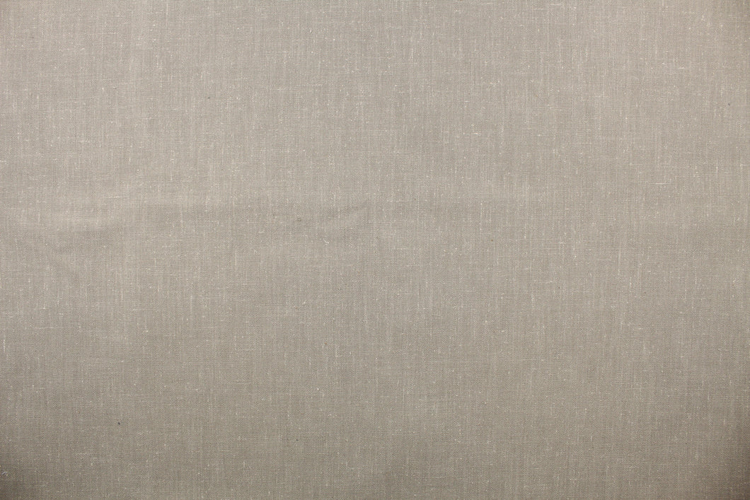 A linen fabric in a taupe gray with speckles of white .