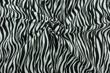 Load image into Gallery viewer,  This fabric features striated stripes in black and white.  The multi use fabric is perfect for window treatments, decorative pillows, custom cushions, bedding, light duty upholstery applications and almost any craft project.  It has a soft workable feel yet is stable and durable.  
