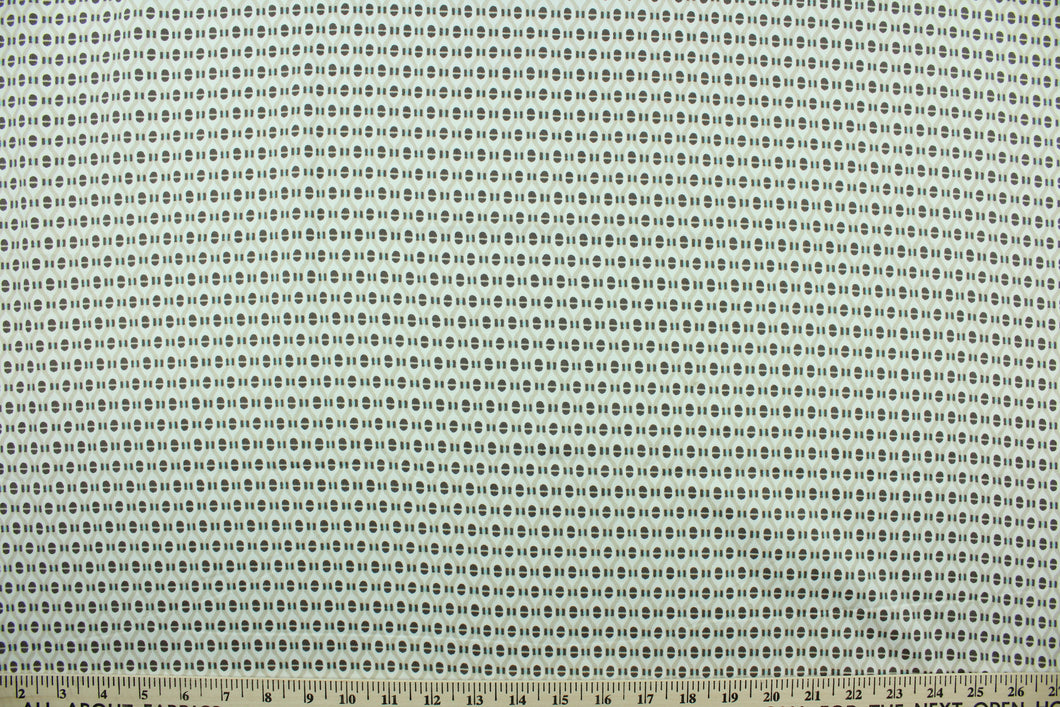  Fairmont features a modern ogee design screen printed on a cotton twill base in the colors of brown, tan and white with hints of mint green and features a soil and stain repellant finish.   The multi use fabric is perfect for window treatments, decorative pillows, custom cushions, bedding, light duty upholstery applications and almost any craft project.  It has a soft workable feel yet is stable and durable with 50,000 double rubs.