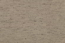 Load image into Gallery viewer, A mock linen in beige with speckles of brown and a cotton scrim backing. 

