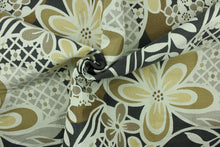 Load image into Gallery viewer, This fabric features a floral design in gold, dark gray, tan and pale beige with a latex backing.
