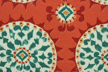 Load image into Gallery viewer,  This outdoor fabric features a medallion  design in teal, golden tan, dark coral, off white, and dark red .

