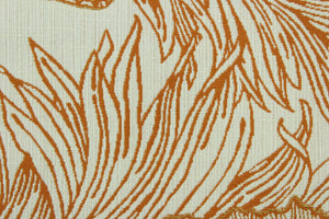 This fabric features a floral and butterfly design in orange with hints of gold set against an off white background .