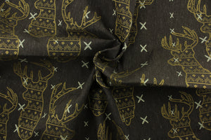 This fabric features a Elk head design in golden tan and beige set against a brown background with a latex backing. 