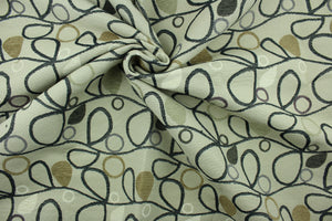 This fabric features a unique design in gray, black, beige, purple, taupe, and cream set against a beige background with a latex backing.