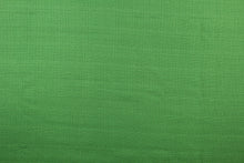 Load image into Gallery viewer,  A mock linen in a rich green with a cotton scrim backing
