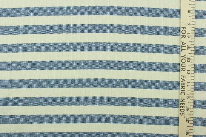 This fabric features a stripe design in blue and natural . 