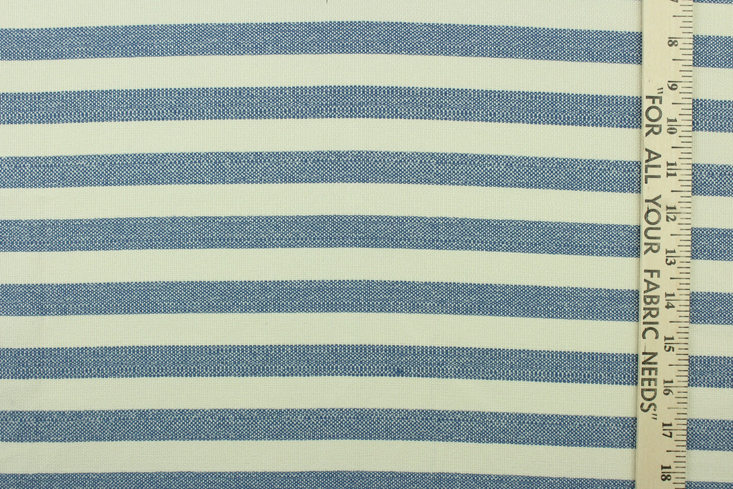 This fabric features a stripe design in blue and natural . 