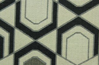 This fabric features a geometric design in black, gray, and beige . 