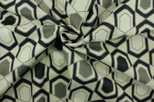 Load image into Gallery viewer, This fabric features a geometric design in black, gray, and beige . 
