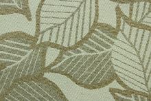 Load image into Gallery viewer, This fabric features a leaf design in a metallic copper, gold, taupe, and pale beige  with a latex backing.
