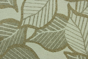 This fabric features a leaf design in a metallic copper, gold, taupe, and pale beige  with a latex backing.