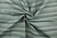 Load image into Gallery viewer,  This fabric features a herringbone stripe design in blue and gray tones .
