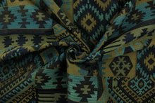 Load image into Gallery viewer, This fabric features an Aztec design in dark brown, tan, black and teal with hints of blue. 

