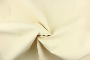   A solid creamy white with  yellow undertones fabric great for umbrellas, outdoor upholstery and more.