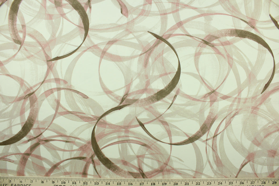 This fabric features a circular design in brown, pink, blush, and beige set against a off white background .