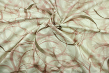 Load image into Gallery viewer, This fabric features a circular design in brown, pink, blush, and beige set against a off white background .

