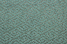Load image into Gallery viewer, This fabric features a geometric design in gray set against a light turquoise blue with a latex backing. 

