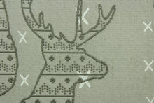 Load image into Gallery viewer, This fabric features a Elk head design in gray and cream set against a beige background with a latex backing.
