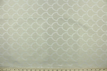Load image into Gallery viewer, This fabric features a geometric design in shiny beige set against a dull beige .
