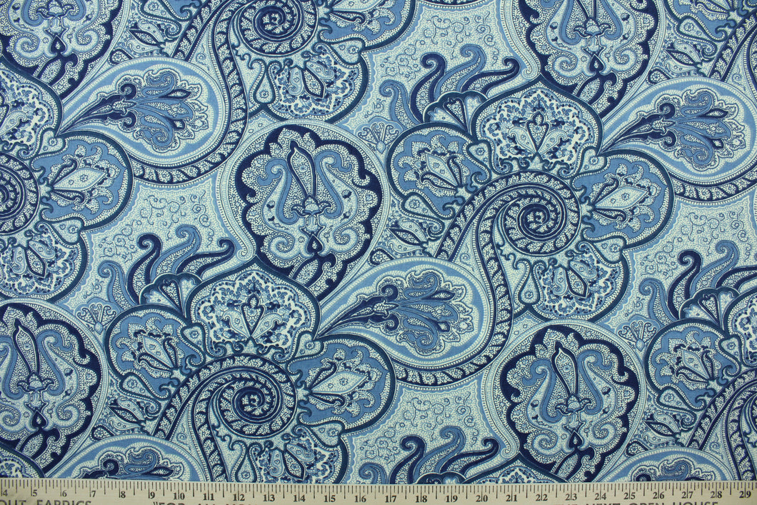 This fabric features a paisley design in shades of blue and cream .