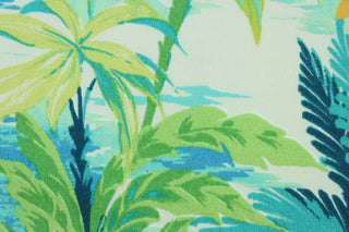 This outdoor fabric features a tropical floral design in orange, green, turquoise, teal, and white.