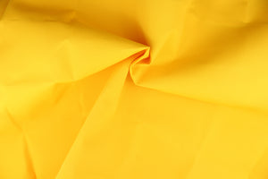 A fabric in a bright yellow great for umbrellas, outdoor upholstery and more. 
