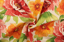 Load image into Gallery viewer, This multi use fabric features a large, floral design in red, orange, pink, yellow, white and green on a cream background.  It is perfect for outdoor settings or indoors in a sunny room.  It is stain and water resistant and can withstand up to 500 hours of direct sun exposure and has a durability rating of 10,000 double rubs.  Uses include decorative pillows, cushions, chair pads, tote bags and upholstery.

