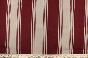 This  fabric features a stripe design in burgundy and light beige.