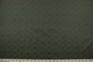  Freta features a basket weave pattern in slate and brown.  It has a slight sheen which enhances the design.  This fabric offers beautiful design, style and color to any space in your home.  It has a soft workable feel and is perfect for window treatments (draperies, valances, curtains, and swags), bed skirts, duvet covers, pillow shams and accent pillows.  