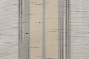  This  fabric features a stripe design  in gray, white, light khaki, and black. 