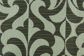 DESCRIPTION:  Ironia features a retro/geometric pattern against a striped background in ebony, blue and brown. This fabric offers beautiful design, style and color to any space in your home.  It has a soft workable feel and is perfect for window treatments (draperies, valances, curtains, and swags), bed skirts, duvet covers, pillow shams and accent pillows.  