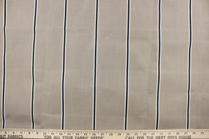 This fabric features a stripe design in beige, black and white. 